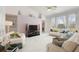 Bright living room with vaulted ceilings, white marble floors and comfortable seating at 5504 Hamlin Close Rd, Davenport, FL 33896