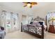 Spacious main bedroom with king-size bed, large window, and tranquil atmosphere at 5504 Hamlin Close Rd, Davenport, FL 33896