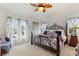 Spacious main bedroom with king-size bed, large window, and tranquil atmosphere at 5504 Hamlin Close Rd, Davenport, FL 33896