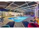 Lovely screened pool with plenty of lounge chairs for relaxing at 5504 Hamlin Close Rd, Davenport, FL 33896