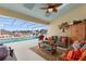 Relaxing poolside patio with lounge chairs and a covered lanai at 5504 Hamlin Close Rd, Davenport, FL 33896