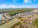 Aerial view of a lakefront community with numerous houses at 636 Mosaic Blvd, Daytona Beach, FL 32124