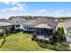 House with a large backyard, screened patio, and lush landscaping at 636 Mosaic Blvd, Daytona Beach, FL 32124