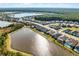 Community view of houses near a lake and conservation area at 636 Mosaic Blvd, Daytona Beach, FL 32124