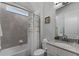 Bathroom with tub shower combo and updated vanity at 636 Mosaic Blvd, Daytona Beach, FL 32124