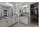 Double vanity bathroom with walk-in shower and closet at 636 Mosaic Blvd, Daytona Beach, FL 32124