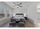 Spacious bedroom with a king-size bed and two armchairs at 636 Mosaic Blvd, Daytona Beach, FL 32124