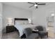 Main bedroom with king bed, two chairs, and ensuite bath at 636 Mosaic Blvd, Daytona Beach, FL 32124