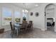 Bright dining room with a farmhouse table and view to backyard at 636 Mosaic Blvd, Daytona Beach, FL 32124