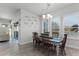 Open dining room with a wooden table and access to the kitchen at 636 Mosaic Blvd, Daytona Beach, FL 32124