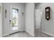 Bright entryway with tile floors and a view of the bathroom and a glass door at 636 Mosaic Blvd, Daytona Beach, FL 32124