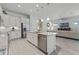 Open concept kitchen features an island and stainless steel appliances at 636 Mosaic Blvd, Daytona Beach, FL 32124