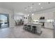 Modern kitchen with island, white cabinets, and stainless steel appliances at 636 Mosaic Blvd, Daytona Beach, FL 32124