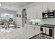 Modern kitchen with granite countertops and stainless steel appliances at 636 Mosaic Blvd, Daytona Beach, FL 32124