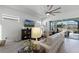 Open living room with large sectional sofa and access to backyard at 636 Mosaic Blvd, Daytona Beach, FL 32124
