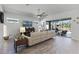 Living room with sectional sofa and sliding doors to lanai at 636 Mosaic Blvd, Daytona Beach, FL 32124