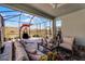 Relaxing screened patio with seating area and water view at 636 Mosaic Blvd, Daytona Beach, FL 32124