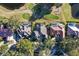 An aerial view showcases three homes near a golf course, each featuring private pools and well-maintained yards at 661 Cricklewood Ter, Lake Mary, FL 32746