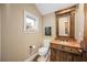 Charming half bath with stone countertop and unique decorations at 661 Cricklewood Ter, Lake Mary, FL 32746