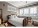 Cozy bedroom with natural light, plantation shutters, and stylish furnishings at 661 Cricklewood Ter, Lake Mary, FL 32746