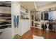 Organized walk-in closet with custom shelving, drawers, and ample space for clothing and accessories at 661 Cricklewood Ter, Lake Mary, FL 32746