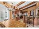 Open floor plan shows a kitchen and dining table and chairs under a chandelier at 661 Cricklewood Ter, Lake Mary, FL 32746
