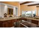 Kitchen showcases counter space, cabinetry, and views of the outside through a wall of windows at 661 Cricklewood Ter, Lake Mary, FL 32746