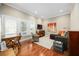 Cozy living room with hardwood floors, plantation shutters, and comfortable seating at 661 Cricklewood Ter, Lake Mary, FL 32746