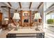 Comfortable living area featuring a built-in entertainment center and seamless outdoor access at 661 Cricklewood Ter, Lake Mary, FL 32746