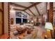Open living space with high ceilings, exposed beams, and seamless transition to outdoor scenery at 661 Cricklewood Ter, Lake Mary, FL 32746