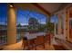 Charming evening view of the screened patio and dining area overlooking the pool and golf course at 661 Cricklewood Ter, Lake Mary, FL 32746