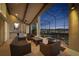 Well-appointed outdoor patio featuring seating and wet bar, with a serene view of the lake and golf course at 661 Cricklewood Ter, Lake Mary, FL 32746
