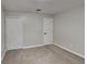 Spacious bedroom featuring neutral walls, carpet flooring, and double door closet at 706 Old Creek Ct, Sanford, FL 32773