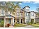 Attractive townhouses with landscaped yards and inviting front porches at 7387 Duxbury Ln, Winter Garden, FL 34787