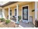 Inviting front porch with seating area and decorative welcome mat at 7387 Duxbury Ln, Winter Garden, FL 34787
