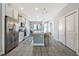 Modern kitchen with stainless steel appliances and breakfast bar at 7387 Duxbury Ln, Winter Garden, FL 34787