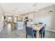 Modern kitchen with island, stainless steel appliances, and dining area at 7387 Duxbury Ln, Winter Garden, FL 34787