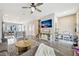 Open living room with tile floors, modern furniture, and a view into the kitchen at 7387 Duxbury Ln, Winter Garden, FL 34787