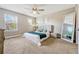 Large main bedroom with plush bed and plenty of natural light at 7387 Duxbury Ln, Winter Garden, FL 34787