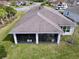 Aerial view showcasing the home's roofline and screened porch at 754 San Joaquin Rd, Kissimmee, FL 34759
