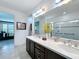 Double vanity bathroom with walk-in shower at 754 San Joaquin Rd, Kissimmee, FL 34759