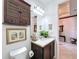 Bathroom with vanity, toilet, and a medicine cabinet at 754 San Joaquin Rd, Kissimmee, FL 34759