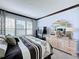 Bright bedroom with a king-size bed and stylish dresser at 754 San Joaquin Rd, Kissimmee, FL 34759