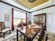 Elegant dining room with large table, hutch, and decorative ceiling at 754 San Joaquin Rd, Kissimmee, FL 34759