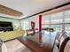 Dining room with glass-top table, view to backyard, and seating for four at 754 San Joaquin Rd, Kissimmee, FL 34759