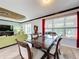 Elegant dining room with glass-top table, views to the living room and backyard at 754 San Joaquin Rd, Kissimmee, FL 34759