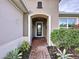 Brick walkway leading to a charming front door with a glass inset at 754 San Joaquin Rd, Kissimmee, FL 34759