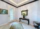 Bright and welcoming foyer with decorative mirror and console table at 754 San Joaquin Rd, Kissimmee, FL 34759