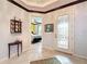 Bright entryway with tile flooring, a glass door, and views into a bedroom at 754 San Joaquin Rd, Kissimmee, FL 34759