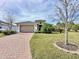 House exterior showcasing the front yard and driveway at 754 San Joaquin Rd, Kissimmee, FL 34759